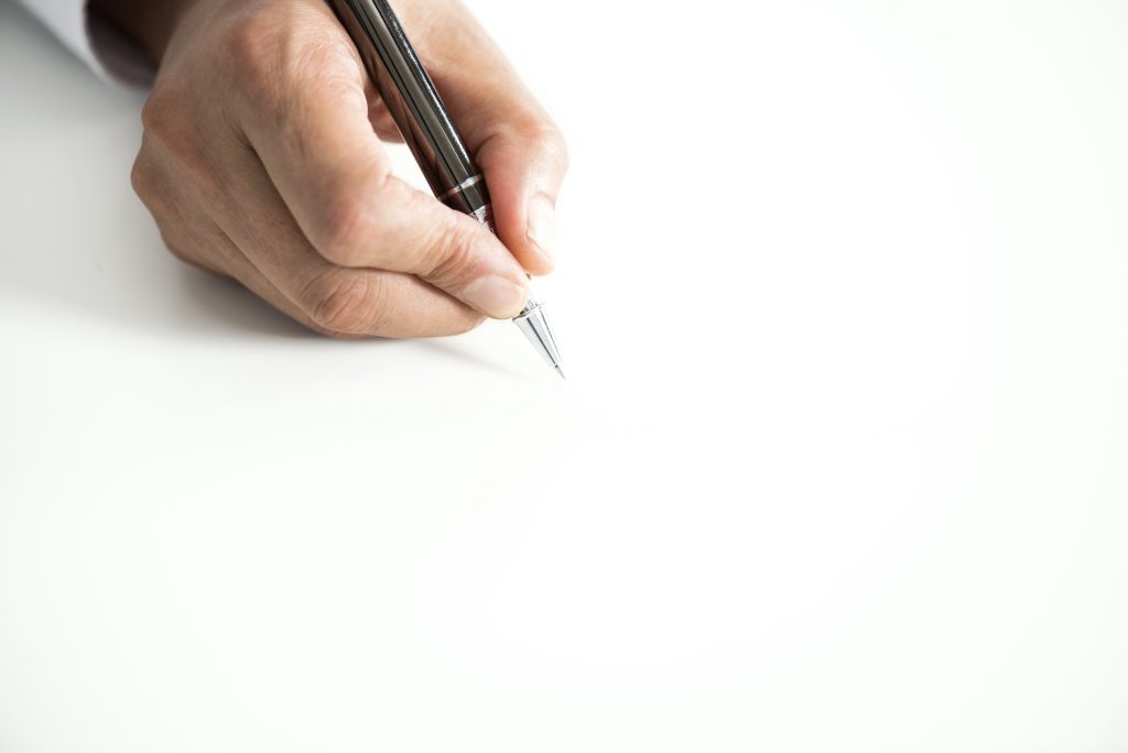 Man signing contract paper, horizontal