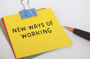 New ways of working text on yellow notepad