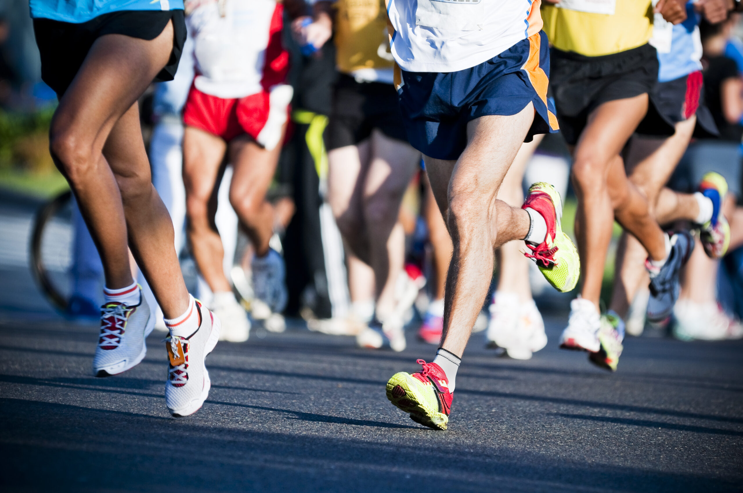 Elite marathon runners competing in a race, illustrating high performance and endurance